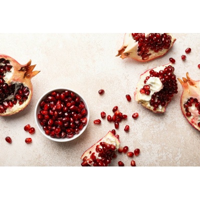 Pomegranate. Fresh organic juicy pomegranate fruit pieces. Pomegranate seeds, grains, top view.