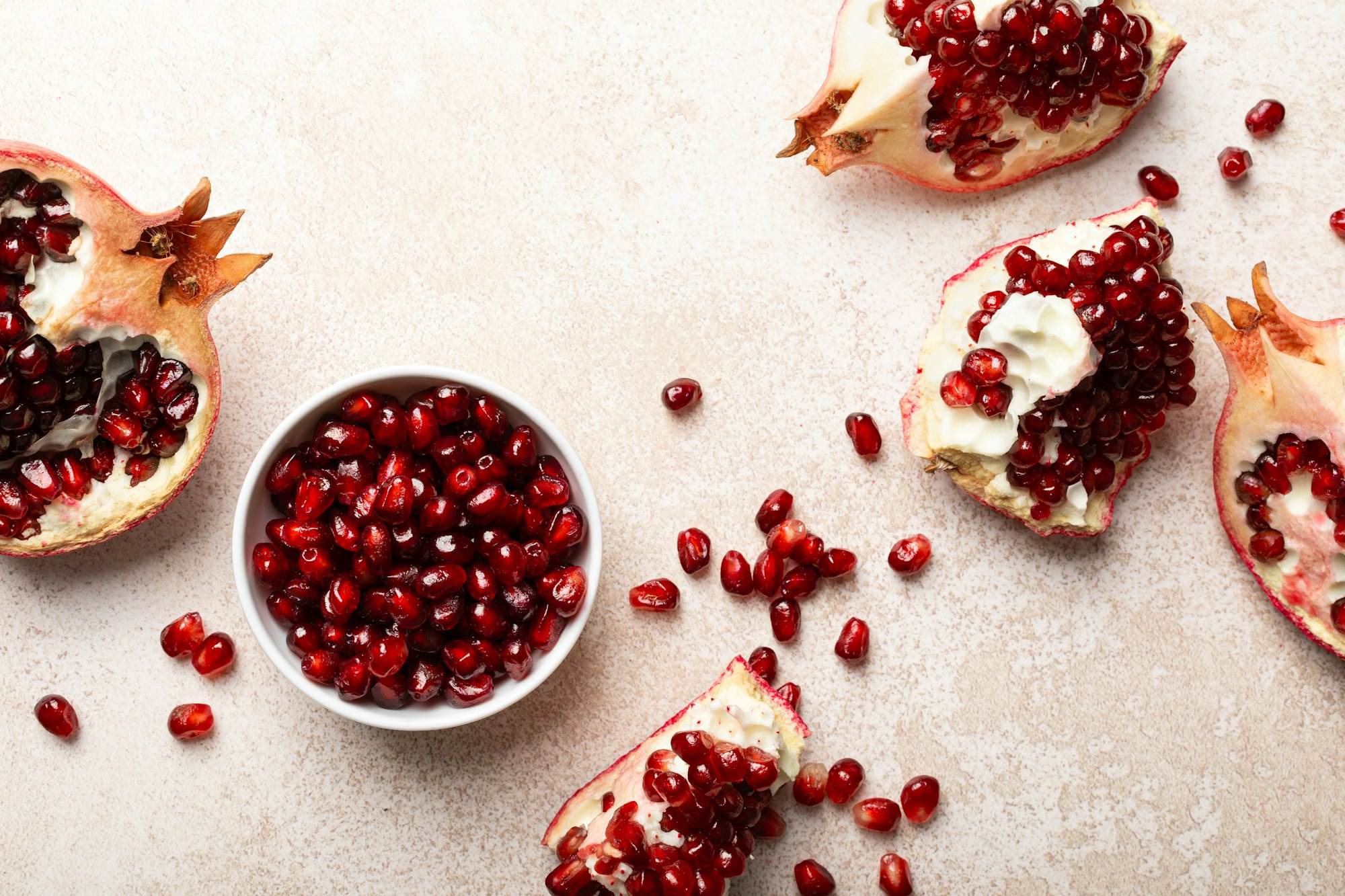 Pomegranate. Fresh organic juicy pomegranate fruit pieces. Pomegranate seeds, grains, top view. Pomegranate. Fresh organic juicy pomegranate fruit pieces. Pomegranate seeds, grains, top view.